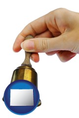 colorado map icon and a bell being rung for the maid or the butler