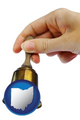 ohio map icon and a bell being rung for the maid or the butler